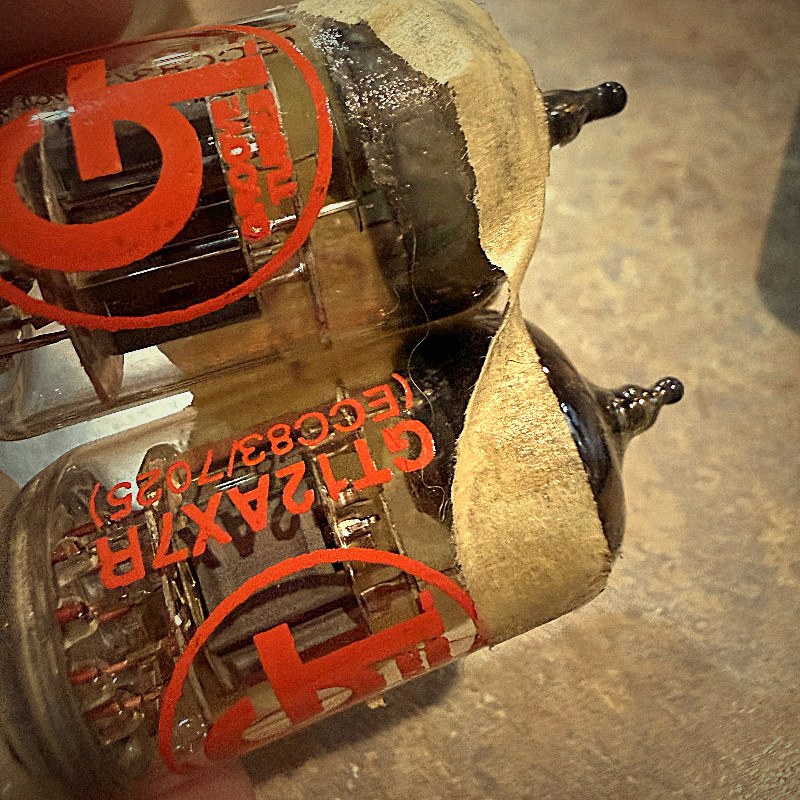 A vacuum tube glowing orange, close up.